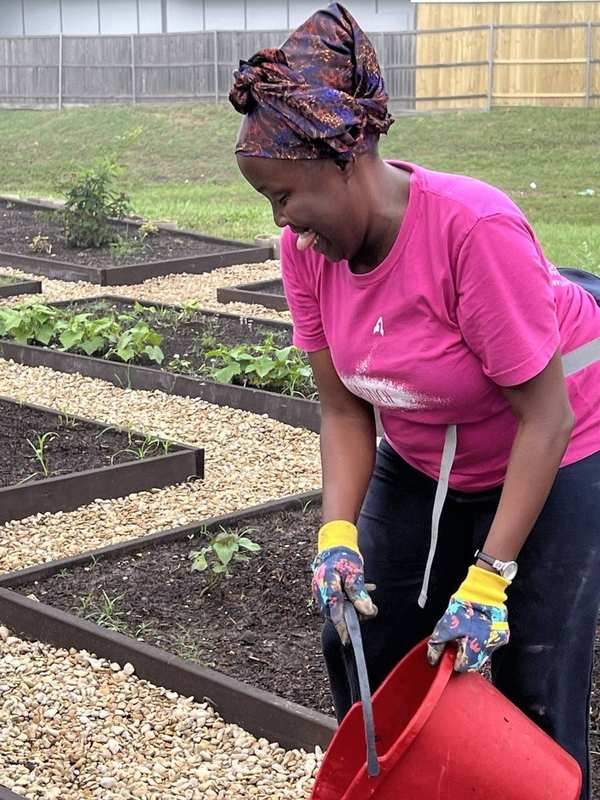 LaKisha working in the garden