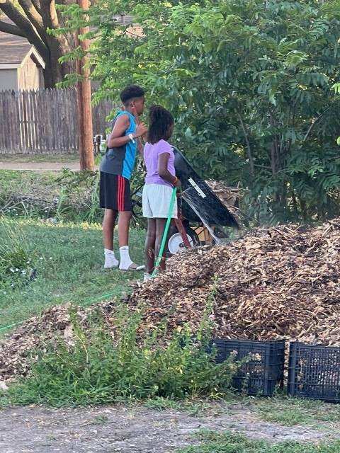 Youth volunteers helping in the garden