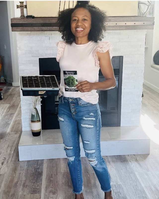 LaKisha with broccoli seed packet and tray