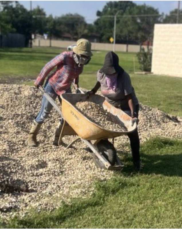 Shoveling gravel for garden paths